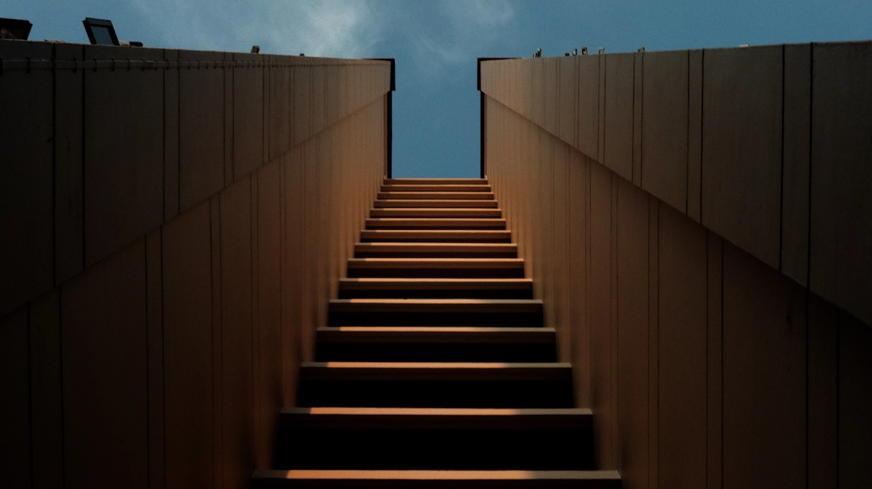 Elevating stairway ascending towards the sky symbolizing progress and aspiration