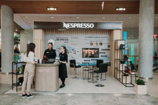 vibrant nespresso stand featuring interactive installations, innovative furnitur...