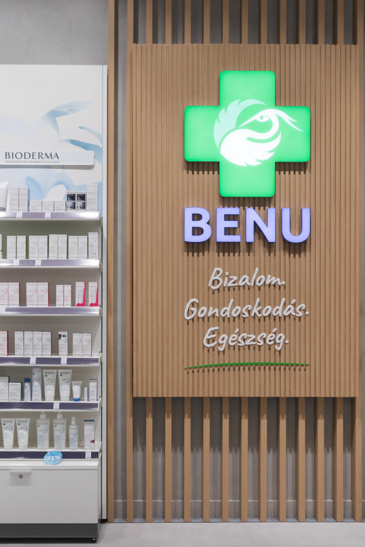 benu_pharmacy_wooden_installation_with_different_nonlightning_and_lightning_signage_elements_next_to_shelving_systems
