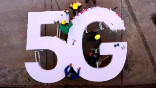 aerial view capturing the Telekom 5G channel letter signage surrounded by people